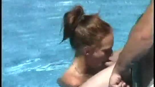 Milf gives blowjob on big hard cock outdoors in pool